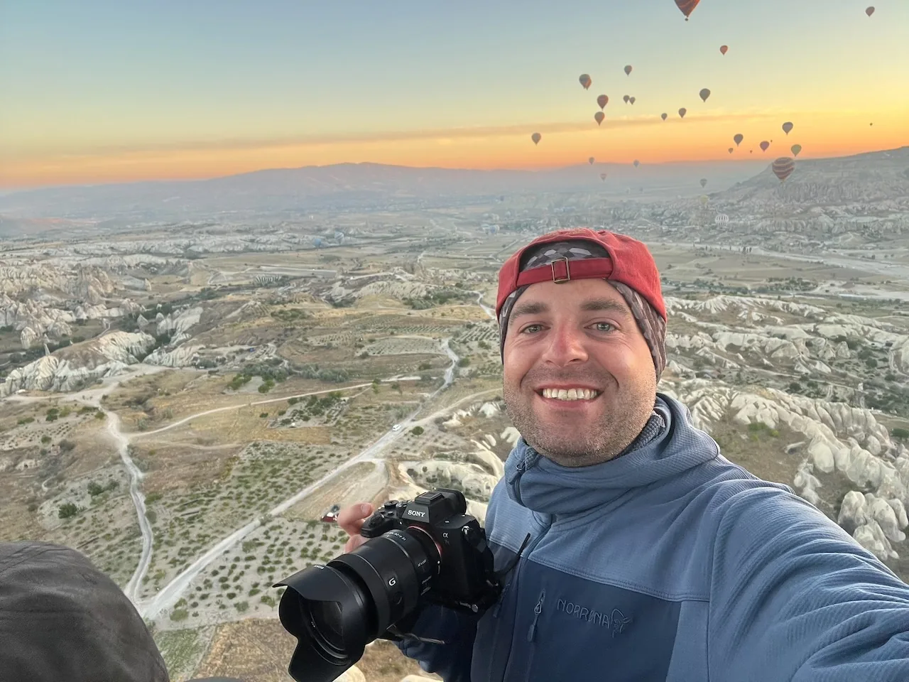 Jan Miřacký taking a selfie from a hot air balloon over Cappadocia at sunrise