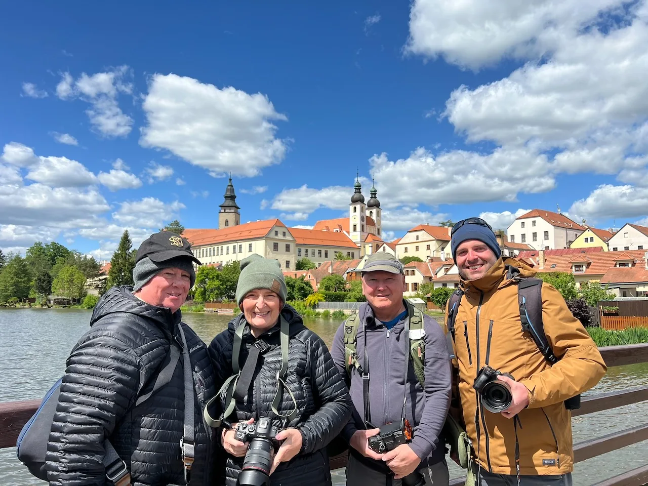 Jan Miřacký leading a photo tour group in front of Telč castle, Czech Republic
